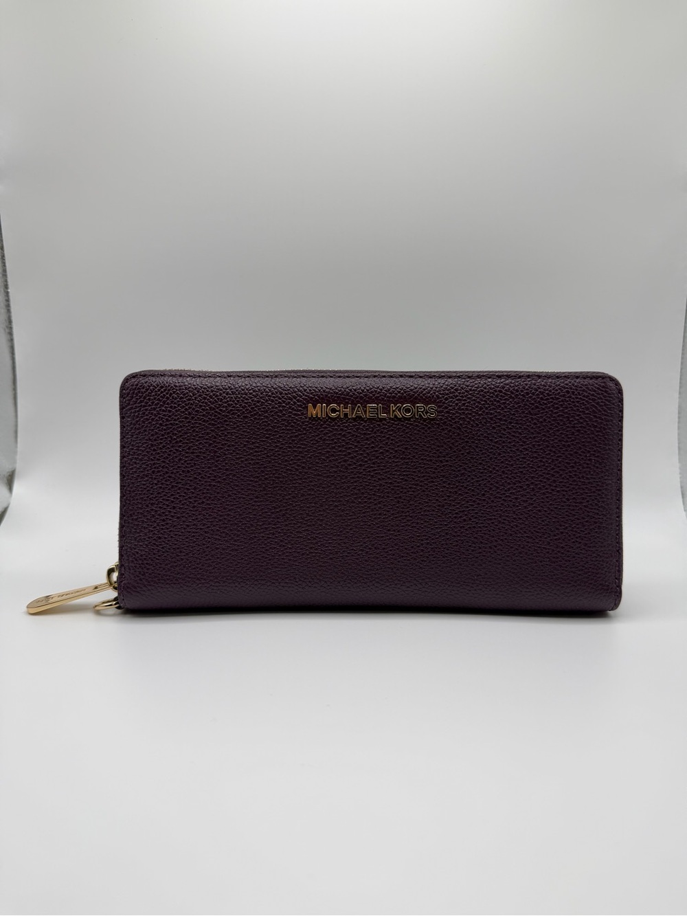 Michael Kors Pebbled Zip-Around Wallet in Plum with Gold Hardware